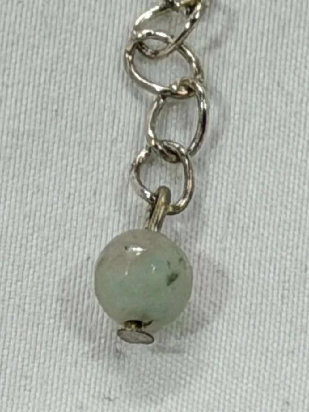 Elegant Silver and Black Necklace with an earthy colored bead